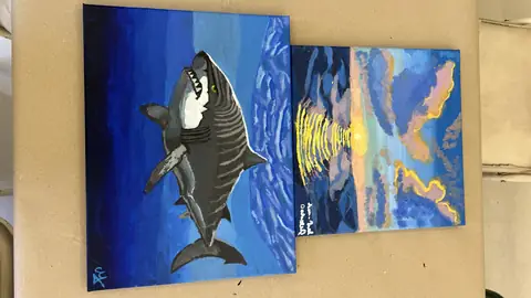 Orca and sunset-over-the-sea canvases painted at the studio