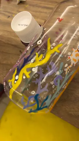Glass jar painted with yellow and blue coral and bubbles