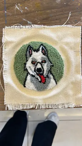 Husky dog punch needle piece on a green background
